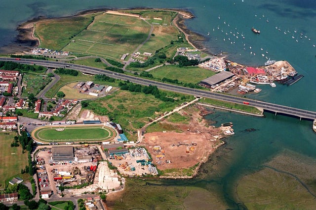 The area of land at Tipner, Portsmouth, bisected by the M275 motorway entrance to Portsmouth, with the greyhound stadium and Pounds yard at bottom left, and the Tipner ranges with Pounds shipbreakers at top in 1999. Picture: Mike Scaddan. 993153-22