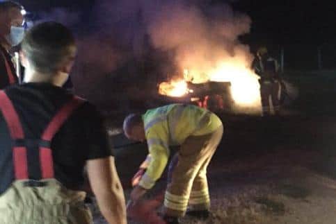 Firefighters tackling the car blaze at a farm on Triangle Lane in Titchfield. Picture: Portchester Fire Station 