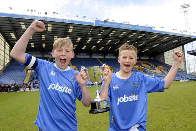 Flashback to April 2013 - Captain Harvey Tanner, left, and Tommy Leigh after Priory School won the Hampshire Schools U13 Cup final against Salesian College at Fratton Park. 
Picture: Ian Hargreaves