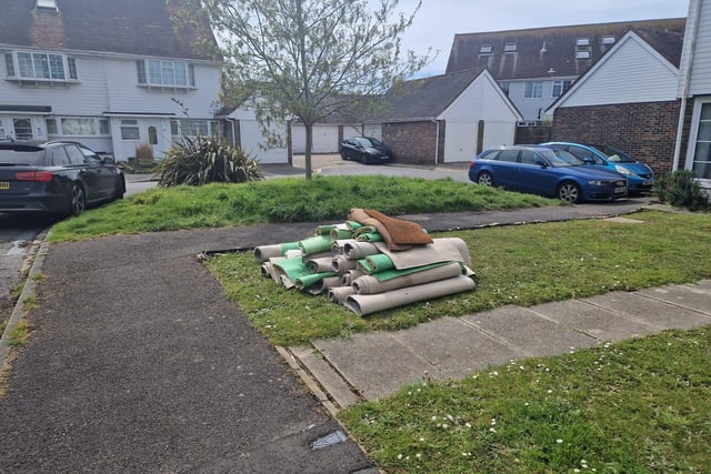 Carpets discarded outside a Langstone home following the flood.