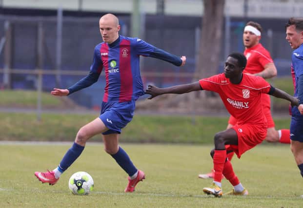 Harry Birmingham, left, in action for US Portsmouth during last weekend's FA Vase quarter-final win against Flackwell Heath. Picture: Stuart Martin