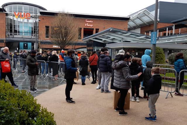Shoppers queue for Nike Factory Outlet in Gunwhaf Quays. Picture: David George