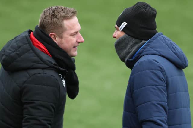 Hawks boss Paul Doswell, right, and Ebbsfleet manager Dennis Kutrieb come face to face during a heated National League South meeting in February. Picture: Dave Haines