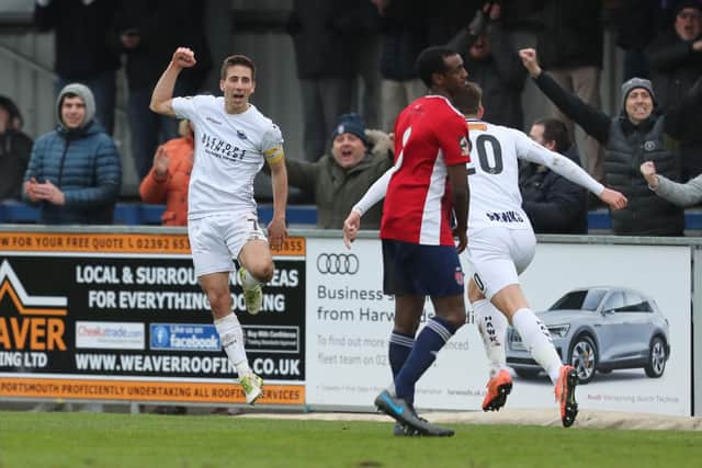 Wes Fogden, left, celebrates scoring Hawks' opening goal against Hampton with sub Alfie Rutherford (20).Photo by Dave Haines