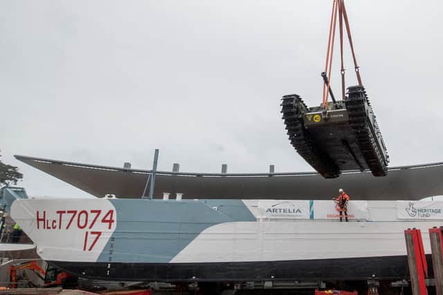 A Churchill Crocodile tank is craned onto the restored World War Two landing craft LCT 7074 outside The D-Day Story in Southsea, Hampshire. PA Photo. Picture date: Thursday August 27, 2020. Andrew Matthews/PA Wire