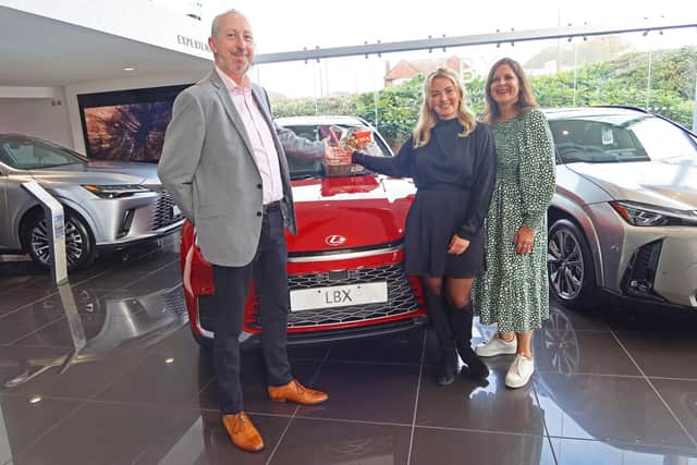 From left, Bruce Simpson, Olivia Snow and Natasha Dochniak – plus a hamper to be awarded to the winner of a competition being organised to mark the launch of the partnership between Lexus Hedge End and Hampshire Fare