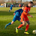 Joe Noakes (orange) in action for AFC Portchester against Baffins in February 2020. Picture: Vernon Nash