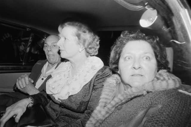 British Prime Minister Margaret Thatcher and her husband Denis (1915 - 2003) leave the Grand Hotel in Brighton, after a bomb attack by the IRA, 12th October 1984. With them in the car is Margaret Thatcher's friend and aide Cynthia Crawford. Five people were killed and over thirty injured in the attack. (Photo by John Downing/Getty Images)