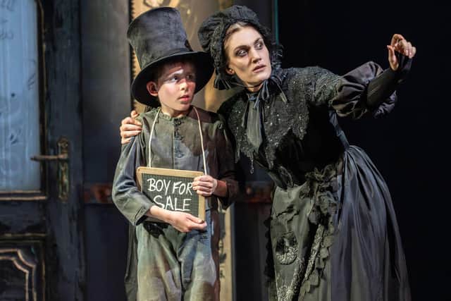 Cian Eagle-Service (Oliver) with Jamie Birkett (Mrs Sowerberry) in Oliver! at Chichester Festival Theatre. Photo by Johan Persson