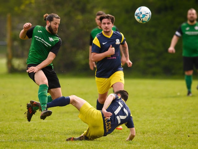 Action from Saturn Royale's 1-0 win over Pelham Arms (blue and yellow kit) in the second Adelaide Cup semi-final. Picture: Keith Woodland (300421-649)
