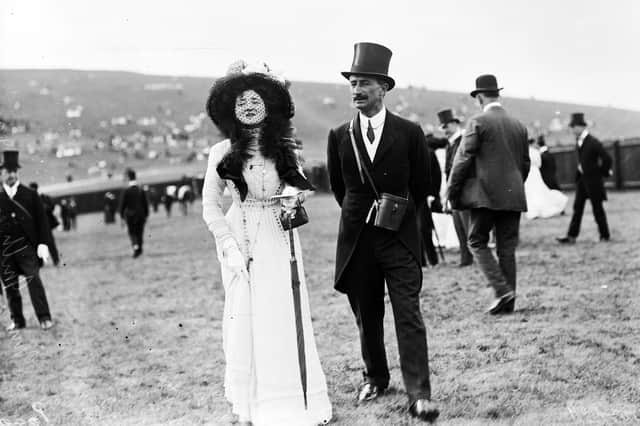 circa 1909: Captain Hanky and Miss Millicent James at a race meeting in Goodwood.  (Photo by W. G. Phillips/Phillips/Getty Images)