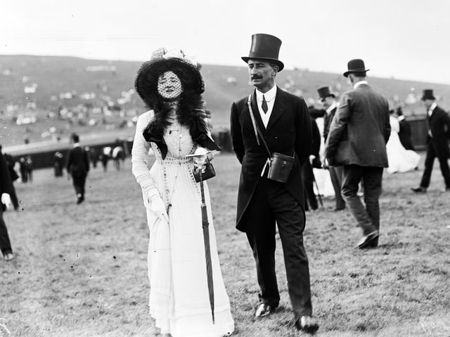 circa 1909: Captain Hanky and Miss Millicent James at a race meeting in Goodwood. (Photo by W. G. Phillips/Phillips/Getty Images)