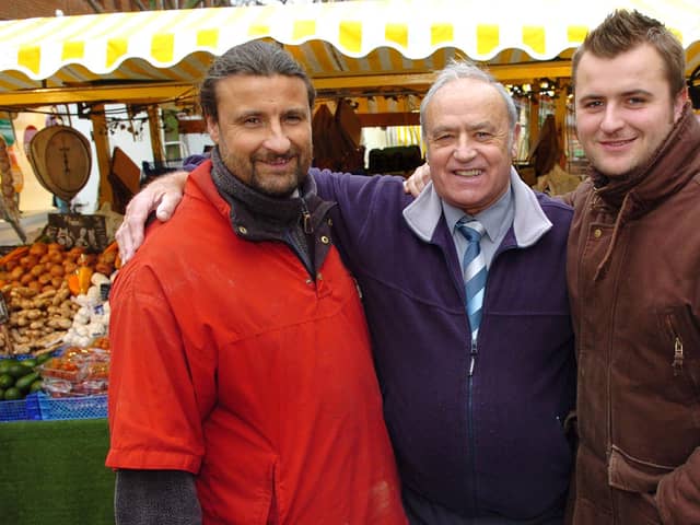 2007. Market traders now placed in Commercial Road Portsmouth. Three of the four generations ¬ (Centre) George Warren (73), with (left) his son Michael (46) and (right) his grandson James (25. Picture: Mallcolm Wells (070151-120)