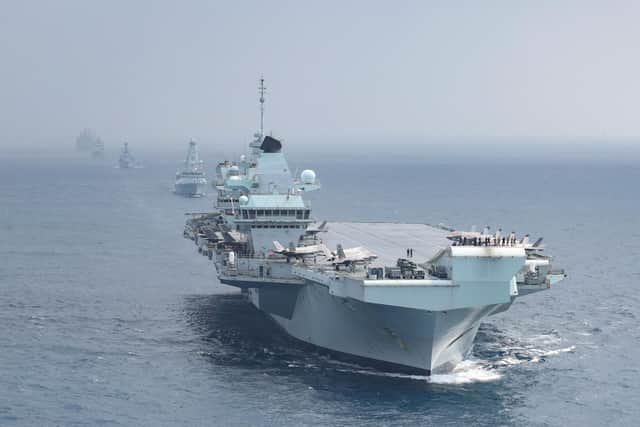 HMS Queen Elizabeth leading a task group during her mission to the Indo-Pacific and back again. Photo: Royal Navy
Pictured: From front to back are HMS Queen Elizabeth, HMS Defender, HMS Richmond, HNLMS Evertsen, RFA Tidespring and RFA Fort Victoria in formation ready to wave off American warship the USS The Sullivans. 


USS THE SULLIVANS DEPARTS THE UK CARRIER STRIKE GROUP

On 19th October 2021, USS The Sullivans departs the United Kingdom Carrier Strike Group to head back to the United States of America. 

HMS Queen Elizabeth, HMS Defender, HNLMS Evertsen, HMS Richmond, RFA Tidespring and RFA Fort Victoria lined up to wave off USS The Sullivans. 


The Strike Group includes ships from the United States Navy, The Dutch Navy, and Marines from the US Marine Corps. As well as UK Frigates, Destroyers two RFA supply ships and air assets from 617 Sqn, 820 NAS, 815 NAS and 845 NAS. This will be the largest deployment of Fifth Generation Fighter Jets in history.