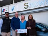 Richard Mead and his wife Ingrid are flanked by Tani Naduva, a Sales Executive at Snows BMW Portsmouth, and Diana Mackinnon, Head of Business, Snows BMW and MINI.