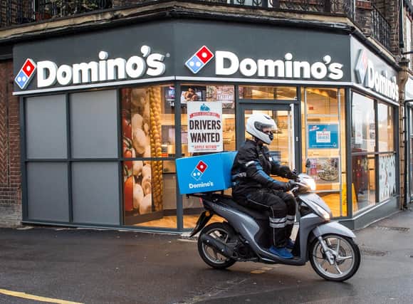 Domino's said it is looking to hire around 5,000 people as these temporary staff members call time on their lives as pizza chefs or delivery drivers. Photo: Domino's/PA Wire