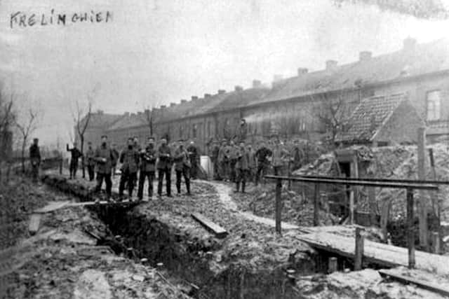 German soldiers walking freely out of the trenches on Christmas Day 1914.