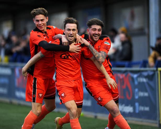 Portchester defender Conor Bailey, middle, celebrates his goal in Tuesday's thrilling draw withformer club Moneyfields.
Picture: Sarah Standing