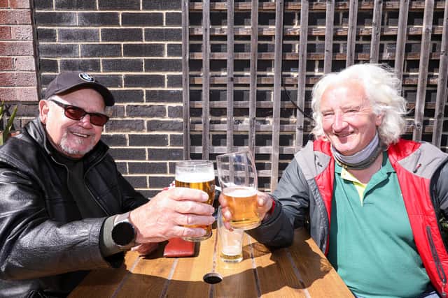 Ray Alford, left, and Phil Lymath. Drinkers enjoy the sunshine at the Parchment Makers, Havant
Picture: Chris Moorhouse (jpns 240421-16)