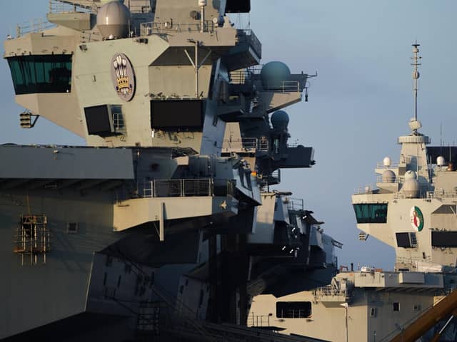 The towers of HMS Prince of Wales (left) and HMS Queen Elizabeth (right) are seen on December 30, 2019 in Portsmouth. Photo: Peter Summers/Getty Images