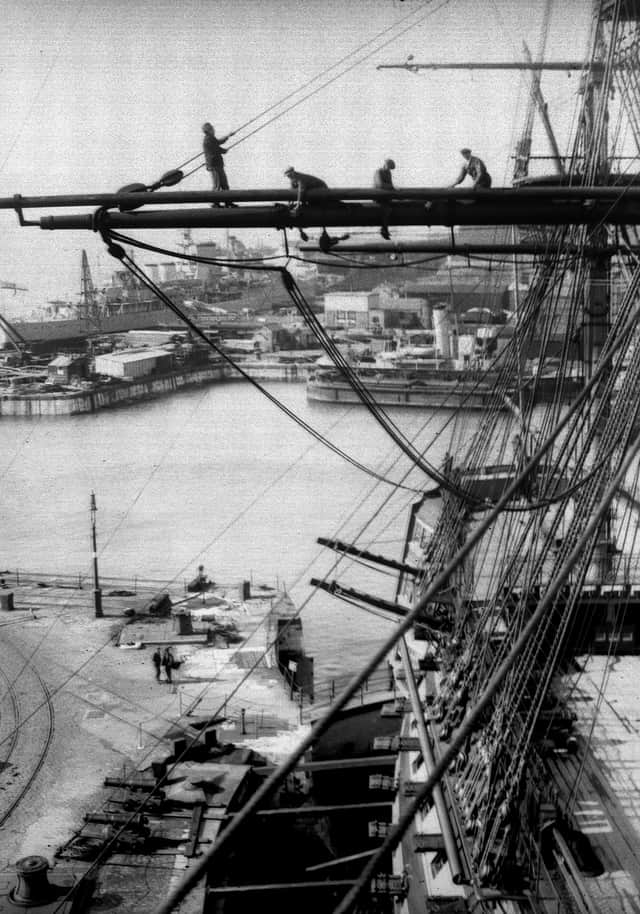 April 20, 1934:  Riggers at work on Nelson's flagship, HMS Victory in Portsmouth dockyard. She was re-rigged every five years and would be ready in time for Navy Week when thousands of visitors would look around her. Picture: Getty.