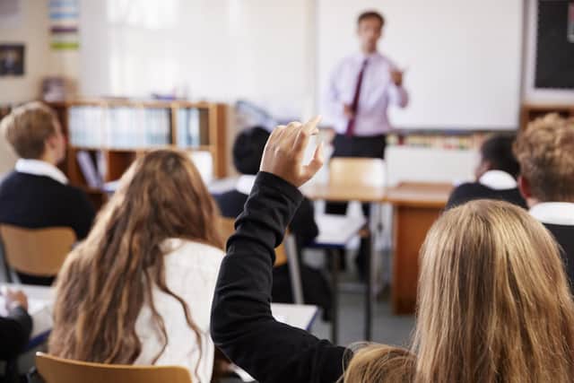 Student puts their hand up.