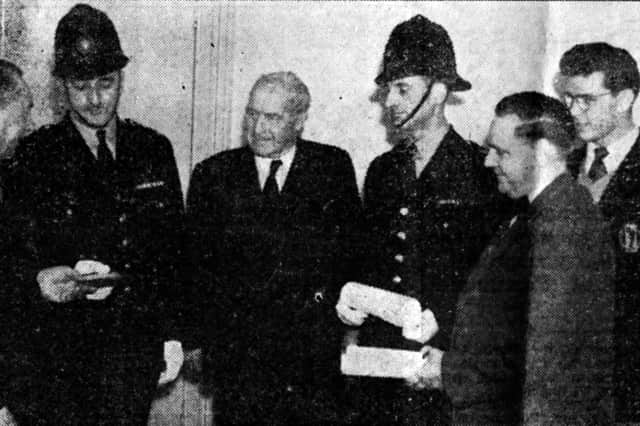 Edward Abrook, right, at an award ceremony to receive a Royal Humane Society award plus a vellum testimonial. Picture: The News archive.