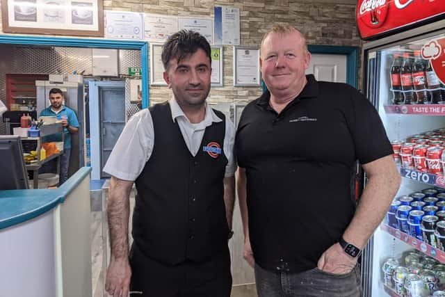 From left: Adam Altunatmaz, owner of Station Cafe, with Paul White, a regular at the cafe. Picture: Emily Turner