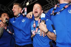 Noel Hunt celebrates Pompey's League Two title triumph. Picture: Joe Pepler