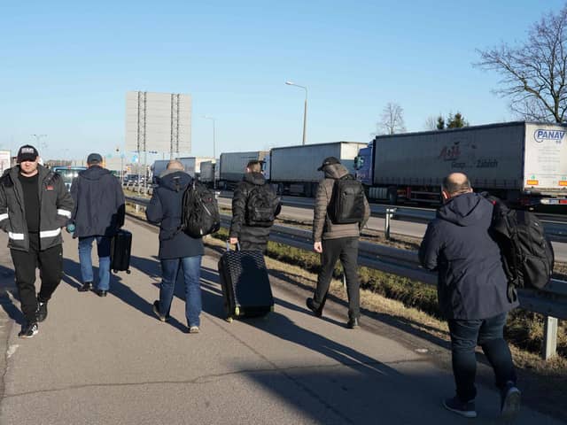 Ukrainian men make their way back to their homes at the Dorohusk border crossing between Poland and Ukraine Picture: Janek Skarzynski/AFP via Getty Images