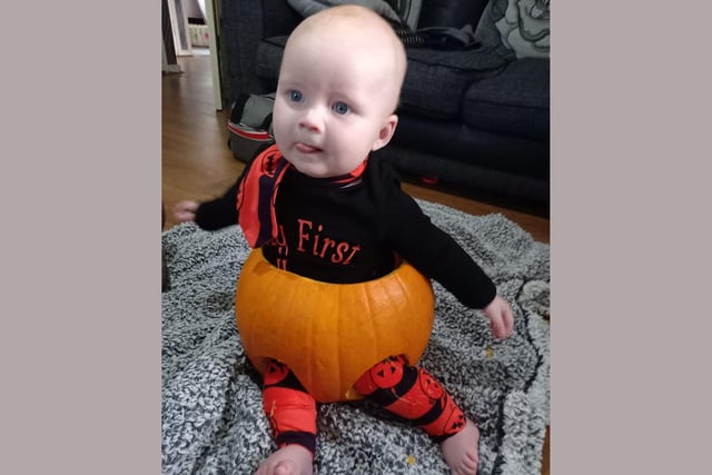 Hudson got dressed up as a pumpkin for his first Halloween.