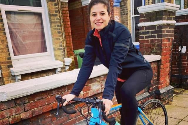 Cllr Charlotte Gerada on a bicycle.