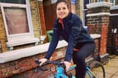 Cllr Charlotte Gerada on a bicycle.