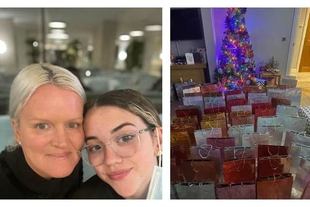 Lisa Henning and daughter Emmy Grace and some of the books they collected