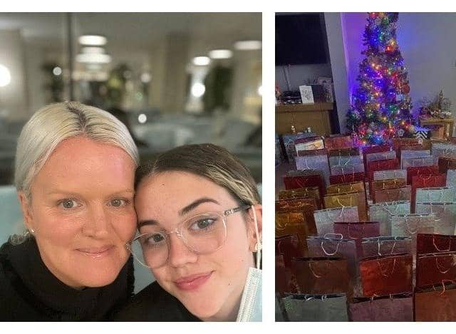 Lisa Henning and daughter Emmy Grace and some of the books they collected