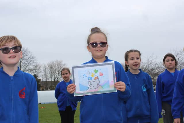 Youngsters take part in activities.