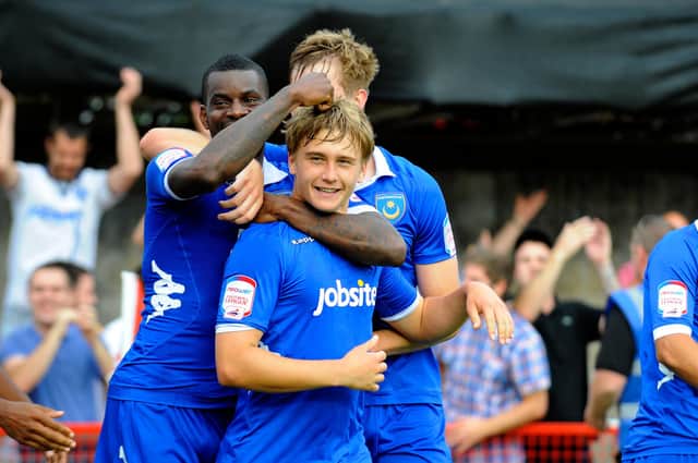Goalscorers Izale McLeod and Ashley Harris celebrate during Pompey's 3-0 victory at Crawley in September 2012. Picture: Allan Hutchings