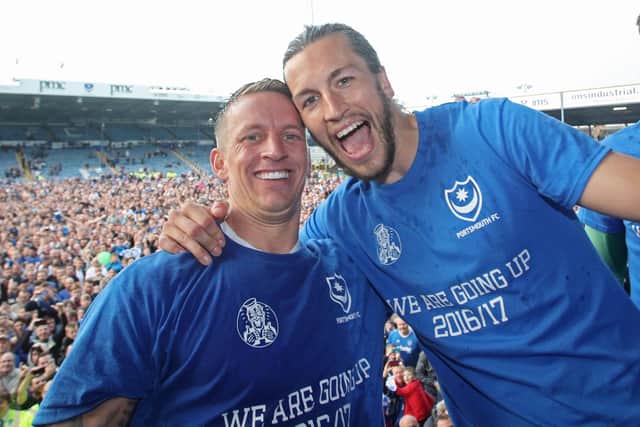 Christian Burgess, right, celebrates Pompey's 2016-17 League Two title win with Blues team-mate Carl Baker.  Picture:Joe Pepler