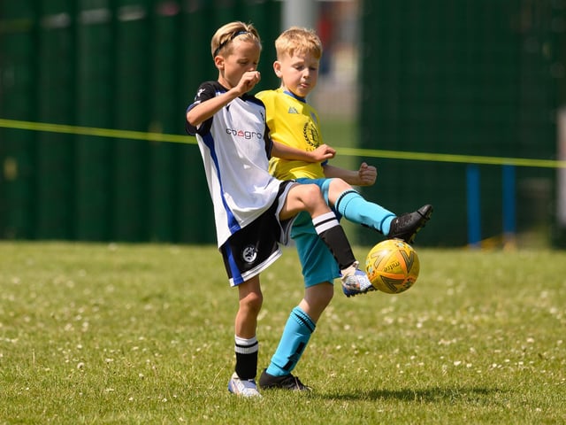 Action from the Clanfield youth football tournament at Horndean Technology College. Picture: Keith Woodland (270521-617)