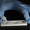 Performing a lateral flow test .pic Richard Ponter