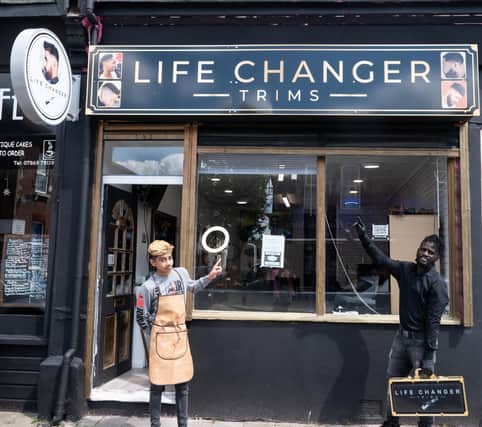 Life Changer Trims barber shop provides apprenticeship to youths to equip them with  essential  skills. 
Pictured: Hussain Arshad and August Joseph John. Picture by Mable Nsingo