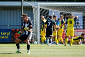 The passion of the FA Cup - a Wimborne player celebrates their equaliser against  Moneyfields. Picture by Dave Bodymore.