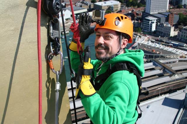 Ryan Penfold, 40, abseiling down the Spinnaker Tower after recovering from a major brain injury.