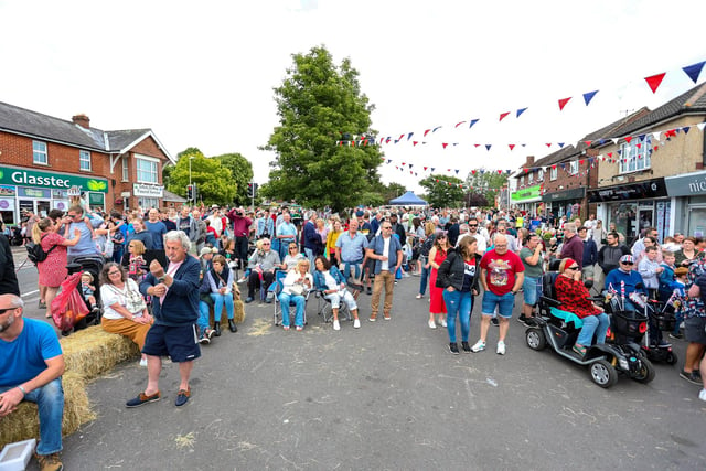 Hundreds of people filled Denmead's shopping area which was closed for live music, dancers and magicians