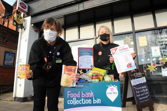The Co-op in The Square, Wickham, started their reverse advent calendar on Tuesday, December 1, asking for donations for Meon Valley Food Bank.
Pictured is: Customer service assistants Jackie Mitchell and Andrea Davanna.
Picture: Sarah Standing (011220-9203)