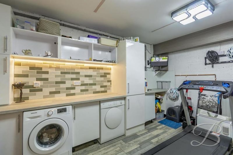 This busy utility room has cupboards for additional storage, a work surface and plumbing for a washing machine and dishwasher. It could even double up as a mini-gym, if required.
