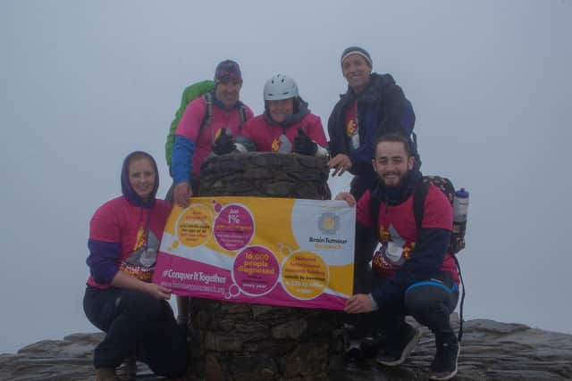 Parapalegic Paul Smith from Cosham with his team on the summit of Mount Snowdon.Pictured: Karen Morling, Sean Broderick, Paul Smith, Alan Smith and Steve-Lee Robinson.Credit: Karen Morling