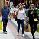 Shoppers wearing face masks in Gunwharf Quays, Portsmouth. Photo: Adrian Dennis/AFP via Getty Images)