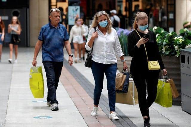 Shoppers wearing face masks in Gunwharf Quays, Portsmouth. Photo: Adrian Dennis/AFP via Getty Images)