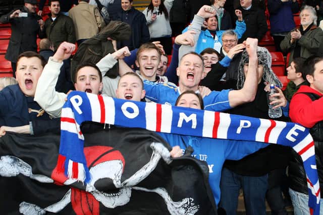 The travelling Pompey support celebrate a first win for four-and-a-half months. Picture: Joe Pepler